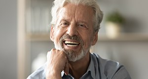 Man smiling with all-on-4 dental implants