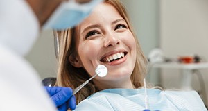 Lady smiles at dentist