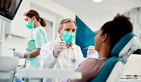 Dentist treats patient