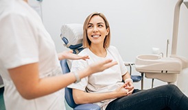 Lady smiles at dentist